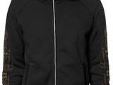 the man is wearing a black hoodie and black pants
