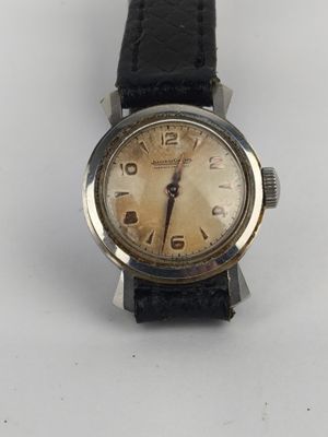 an image of a wrist watch on a white surface