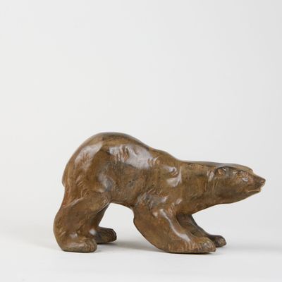 an image of a wooden bear statue on a white background