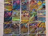 a bunch of pokemon cards sitting on top of a table