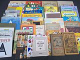 a lot of books that are sitting on a table