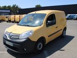 a yellow van that is parked in a parking lot