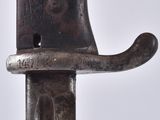 a close up of a metal pipe cutter on a white background