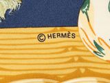 the back of a yellow and blue tie with a picture of a bird on it