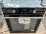 a silver oven that has a price tag on it