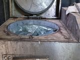 an old washing machine with a mirror on top of it