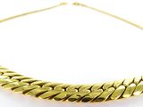 a gold necklace on a white background