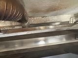 a picture of a machine that is working on a piece of metal