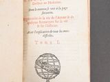 someone is holding a book with a picture of a globe on it