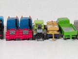 a lot of toy cars that are lined up together