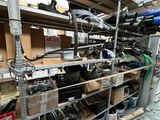 a lot of tools on the shelves in the garage