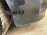 a close up of a sticker on a car ' s bumper
