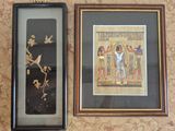 two framed pictures on the wall of a room