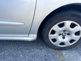 a close up of a car ' s tire on the pavement