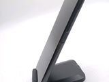 a cell phone that is sitting on top of a stand