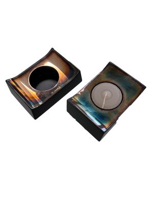 pair of square glass ashtrays with a black base and a brown base
