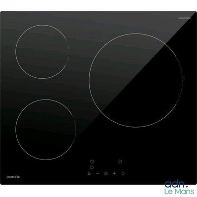 a close up of a black stove top with three burners