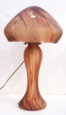 a wooden lamp that is sitting on a table