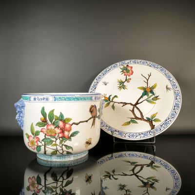 two cups and a saucer sitting on a table
