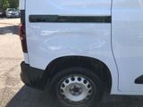 a white van that is parked in a parking lot
