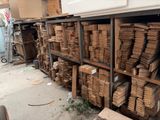many stacks of cardboard boxes on the shelves in the warehouse