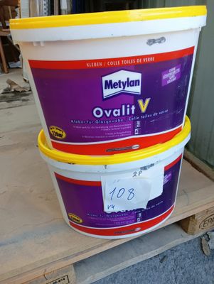two buckets of food sitting on top of a pallet on a pallet