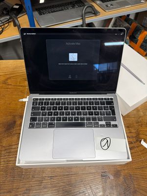 a laptop computer sitting on top of a wooden table