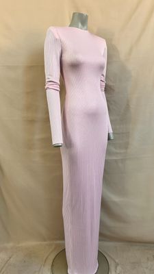 the dress is pink and has long sleeves on it