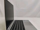 an open laptop computer sitting on top of a white table