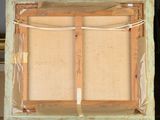 painting on an easel with a piece of cardboard taped around it
