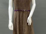 an image of a mannequin wearing a brown dress with a purple belt