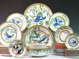 a lot of plates that are sitting on a table