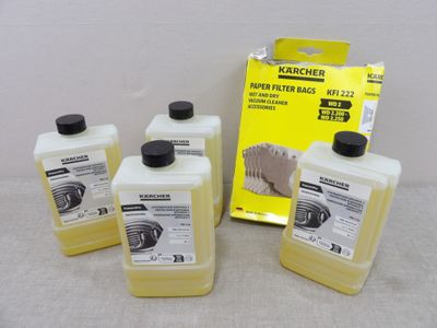 three bottles of soap sit on a table next to a box of soap