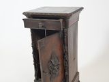 a small wooden cabinet with a door open on a white background
