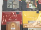 four books on a white table with a white table cloth