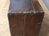 a wooden box sitting on top of a wooden table