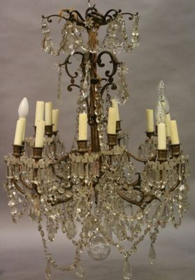 Lustre à seize bras de lumière sur deux rangs, ornés de guir… - Photo 1