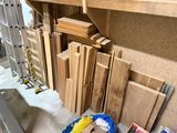 several pieces of wood are stacked on top of each other in a room