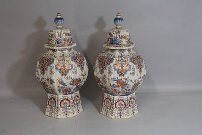 two vases that are sitting on a table