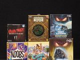 a lot of board games sitting on a black table