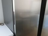 a refrigerator and a dishwasher in a kitchen