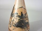 a vase that has a picture of a man and a horse on it