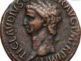 a close up of a coin with a woman ' s face on it