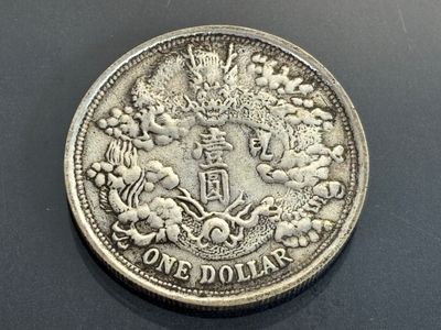 a close up of a one dollar coin on a table