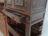 a large wooden cabinet with a lot of drawers