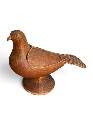 a bird that is sitting on top of a table