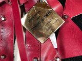 a teddy bear with a tag on it ' s chest