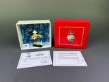 an image of a boxed box with a figurine of a man in a yellow shirt
