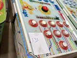 a table with a pinball game on it in a room