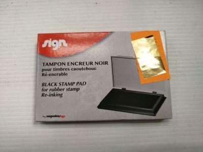 emballage d'un tampon encreur noir surmonté d'un tampon doré